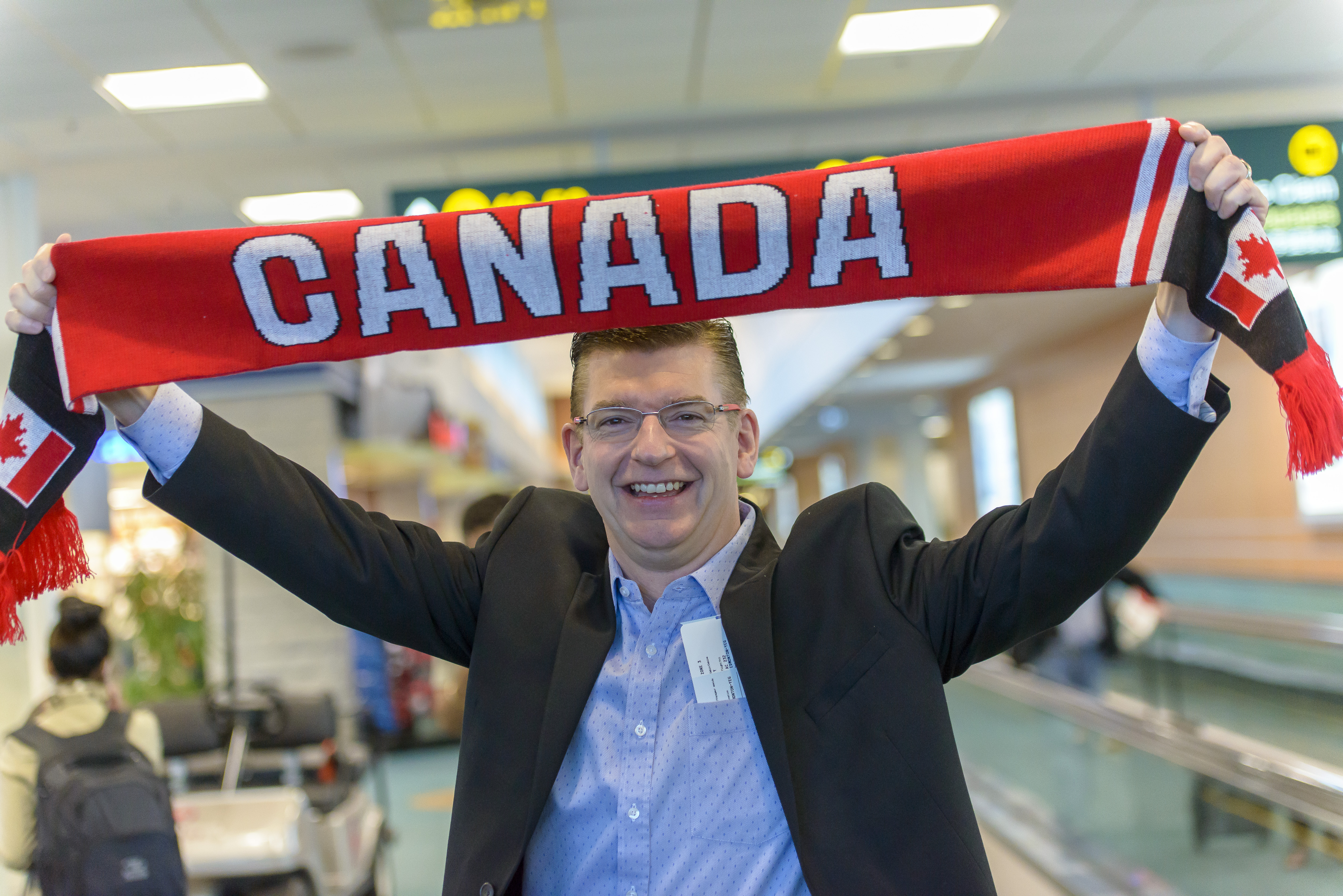 Iain Black holding a Canadian scarf